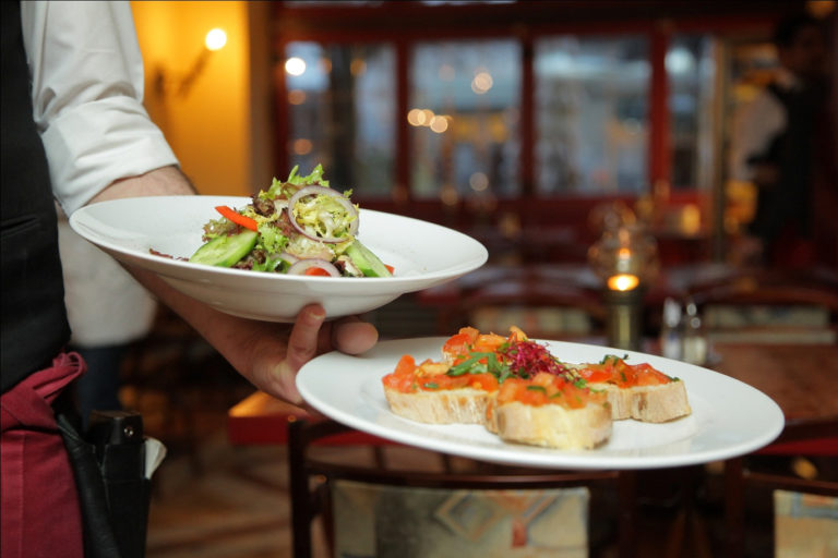 waiter serving dishes